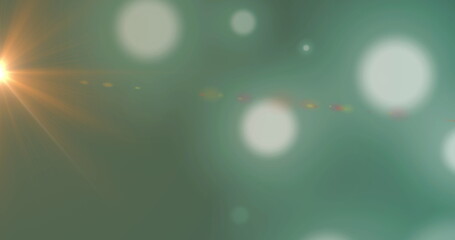 Poster - Digital image of spots of light against copy space on green background