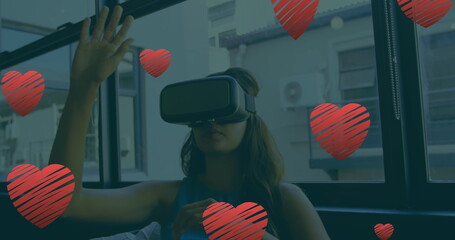 Poster - Image of falling hearts over caucasian woman using vr headset