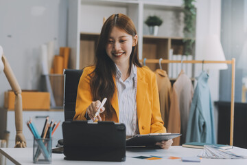 portrait beautiful smile asian designer woman use computer in tailer fabric fashion small business o