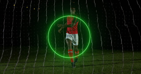 Poster - Image of neon geometrical shapes rotating over african american male soccer player