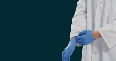 Canvas Print - Image of midsection of caucasian male doctor wearing gloves against black background