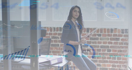 Poster - Image of multiple graphs and trading board over caucasian woman using digital tablet in office