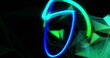 Image of blue and green light trail and glowing shapes moving on black background