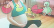 Image of toys icons over caucasian pregnant woman exercising at home