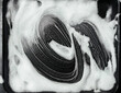 White foam and soap on dark background. The concept of washing oily pan or black car. Abstract pattern.