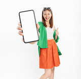 Fototapeta  - Studio shot of Beautiful Asian woman holding smartphone mockup of blank screen and smiling on white background.