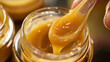 © RealityForge - Body wax being heated and prepared in a jar with a spoon for application in a spa or salon