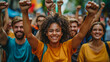 © Alina Tymofieieva - Multiracial people raise their hands in the air at a meeting. A group of people spend time outdoors. Concept of protests, speeches.