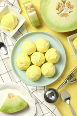 Wall Mural - Ice cream scoops in a bowl with slices of fresh melon