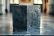 An elegant marble cube with intricate natural textures showcased in warm ambient lighting