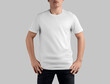 White t-shirt mockup on guy in black jeans, crew neck shirt for design, print, branding, front view.