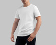 White t-shirt template on sporty guy in dark jeans, men's crew-neck shirt, front view, isolated on studio background.