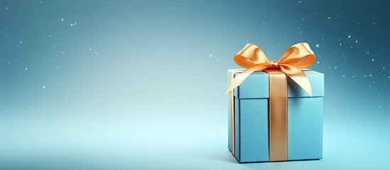 Poster - A Christmas gift box is placed on a blue background providing a blank space for a mock up image. with copy space image. Place for adding text or design