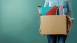 © Dara - Dismissed employee carries a box of office supplies, symbolizing job loss.