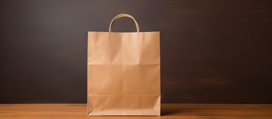 Aufkleber - Copy space image featuring a recyclable paper bag isolated on a brown paper background perfect for shopping and made from kraft paper
