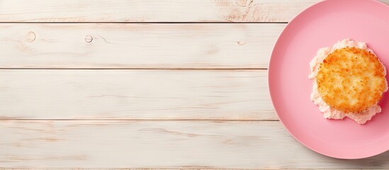 Aufkleber - Top down view of a fried camembert atop a pink plate situated on a pristine white wooden surface The arrangement offers ample copy space for text within the frame