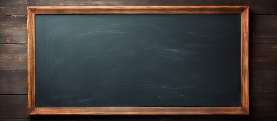 Poster - An empty blackboard featuring a hand in the image providing copy space