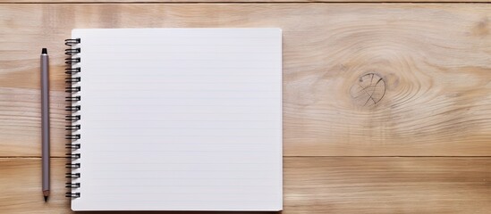 Aufkleber - Wooden surface with a blank spiral note pad and silver pen perfect for capturing ideas and thoughts creating a copy space image