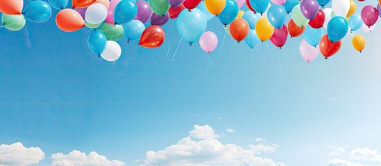 Poster - A clear blue sky serves as a backdrop for a vibrant display of colorful balloons creating an image with plenty of open space. with copy space image. Place for adding text or design
