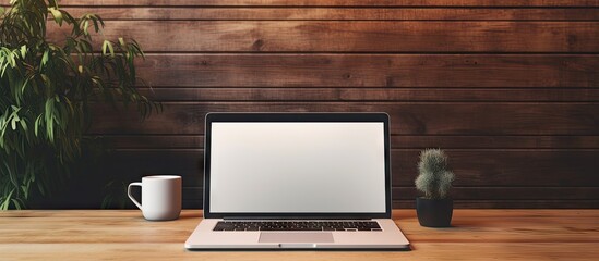 Poster - A trendy workspace featuring a stylish laptop displaying a blank screen perfect for adding a personalized design. with copy space image. Place for adding text or design