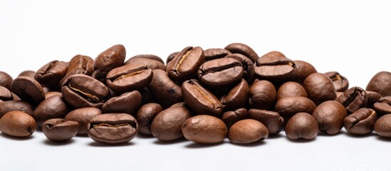 Wall Mural - A close up view of roasted arabica coffee beans with a dark brown color set against a white background Ideal for copy space images