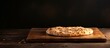 A flat bread with a rustic appearance sits atop a wooden cutting board creating an inviting copy space image