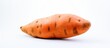 A sweet potato displayed on a copy space image with a plain white background