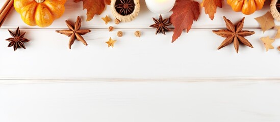 Aufkleber - A cozy autumn themed decoration for Halloween and Thanksgiving consisting of pumpkin candles spicy star anise spices and cinnamon placed on a white wooden background This flat lay image provides ampl