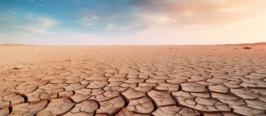 Cracked dry land without any water in an abstract background with copy space image