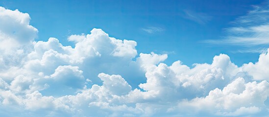 Aufkleber - A clear day with blue skies and fluffy clouds creating a picturesque and pleasant atmosphere Perfect weather for outdoor activities and enjoying the beauty of nature Ideal setting for a copy space im