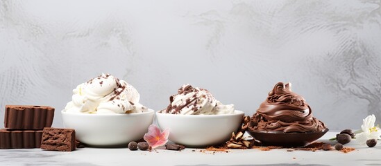 Poster - On a white grey stone table there is a copy space image showcasing small white bowls filled with homemade chocolate ice cream The ice cream is adorned with chocolate pieces and shavings and accompani