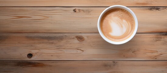 Aufkleber - Top view of a Dalgona coffee cup on a wooden table with ample copy space for an image