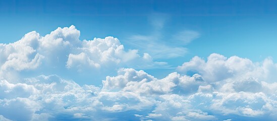 Aufkleber - A copy space image of a spacious blue sky with fluffy clouds stretching across the horizon