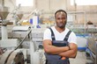© Serhii - Portrait of African American male engineer in uniform and standing in industrial factory
