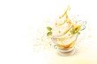 © Sugar AC Design - Soft serve or frozen yogurt or Ice cream with honey in a glass on a white background