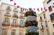 Girona, Spain - May 13th, 2024: TEMPS DE FLORS - Flower Time Festival. Floral representation of the human towers in the town hall square