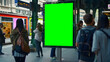 © Tanakorn - Vertical Green Screen Billboard Displayed in Main Train Station on Sunny Summer Day