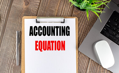 Poster - ACCOUNTING EQUATION text on clipboard paper with laptop, mouse and pen