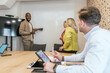 © ADDICTIVE STOCK - Diverse team engaging in a coworking space meeting