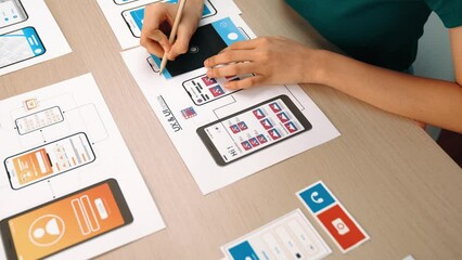 Panorama video of startup company employee planning on user interface prototype for mobile application or website in office. UX UI designer brainstorm designing user friendly interface plan. Synergic