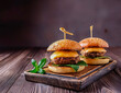 Beef burger on the wooden board with a dark wooden background