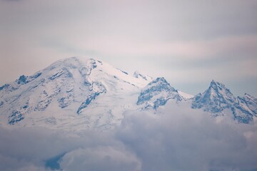Wall Mural - Majestic landscape of snow-covered Mount Baker peaks and cloudy skies