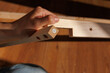 © Maryia - Self-assembly modern furniture by woman