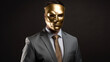 A businessman in a suit and a gold mask hides his face