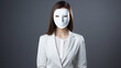 a businesswoman in a white mask hiding her face