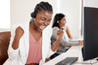 © peopleimages.com - Black woman, call center and celebration at desk in office for customer service, goal achievement and telemarketing. African female agent, headphones and success for promotion bonus and sales deal