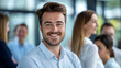 © Yuwarin - businessman leader smiling in front of her team