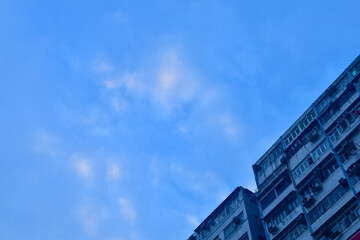 Wall Mural - Exterior of residential building in Hong Kong with skyscape. Details of modern architecture. Building abstract.  Building background.