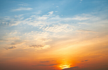 beautiful , luxury soft gradient orange gold clouds and sunlight on the blue sky perfect for the bac