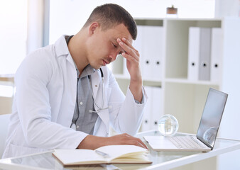 Poster - Laptop, doctor and man with headache, burnout and stress with crisis, overworked and exhausted. Person, medical and professional with pc, tired and physician with migraine, frustrated and fatigue
